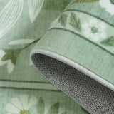 Covaba modern botanical floral rug in sage mist, styled in a room setting, view 2