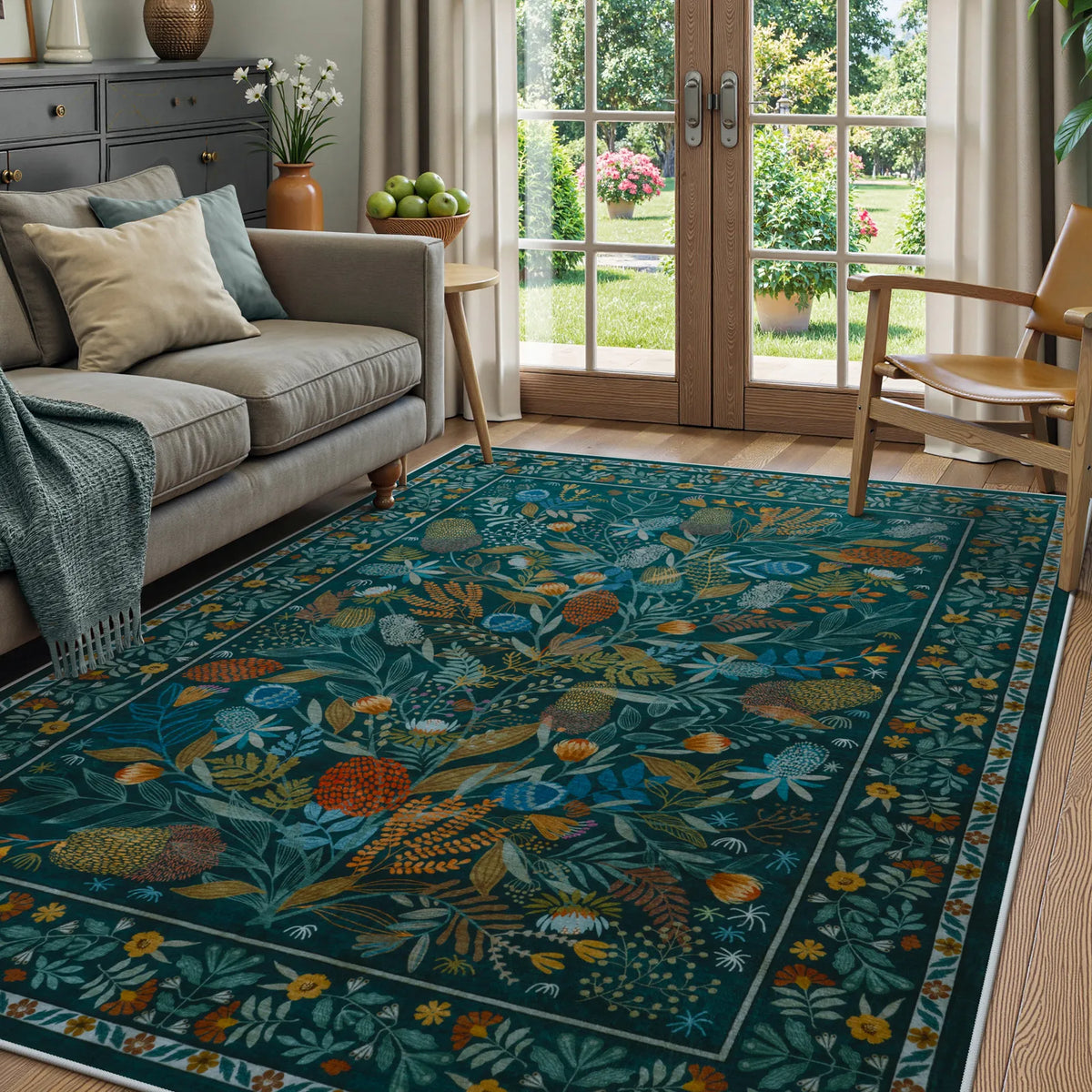Covaba modern botanical floral area rug in stormy blue, styled in a room setting