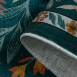 Covaba modern botanical floral rug in stormy blue, styled in a room setting, view 2