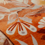 Covaba modern natural botanical floral rug in golden wheat, styled in a room setting