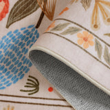 Covaba modern natural botanical floral rug in multicolor, styled in a room setting