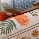 Covaba modern natural botanical floral rug in multicolor, styled in a room setting, view 2