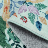 Covaba modern tropical bird runner rug in fern green, styled in a room setting, view 9