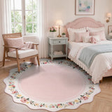 Covaba vintage floral scalloped round rug in blush clay, styled in a room setting