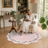 Covaba vintage floral scalloped round rug in blush clay, styled in a room setting, view 5