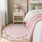 Covaba vintage floral scalloped round rug in blush clay, styled in a room setting, view 6
