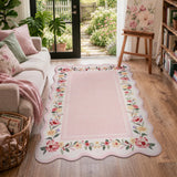 Covaba vintage floral scalloped area rug in blush clay, styled in a room setting, view 5