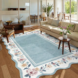 Covaba vintage floral scalloped area rug in dusty blue, styled in a room setting