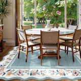 Covaba vintage floral scalloped area rug in dusty blue, styled in a room setting, view 3