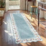 Covaba vintage floral scalloped runner rug in dusty blue, styled in a room setting