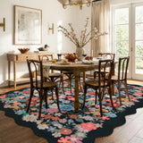 Covaba vintage floral scalloped area rug in ink black, styled in a room setting, view 2