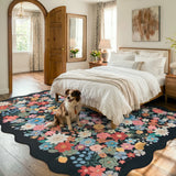 Covaba vintage floral scalloped area rug in ink black, styled in a room setting, view 3