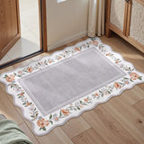 Covaba vintage floral scalloped doormat in muted plum, styled in a room setting