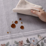 Covaba vintage floral scalloped area rug in muted plum, styled in a room setting, view 5