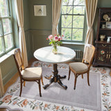 Covaba vintage floral scalloped area rug in muted plum, styled in a room setting, view 2