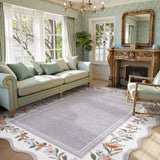 Covaba vintage floral scalloped area rug in muted plum, styled in a room setting, view 3