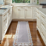 Covaba vintage floral scalloped runner rug in muted plum, styled in a room setting, view 2