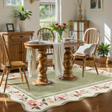 Covaba vintage floral scalloped area rug in willow sage, styled in a room setting, view 8