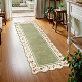 Covaba vintage floral scalloped runner rug in willow sage, styled in a room setting, view 2