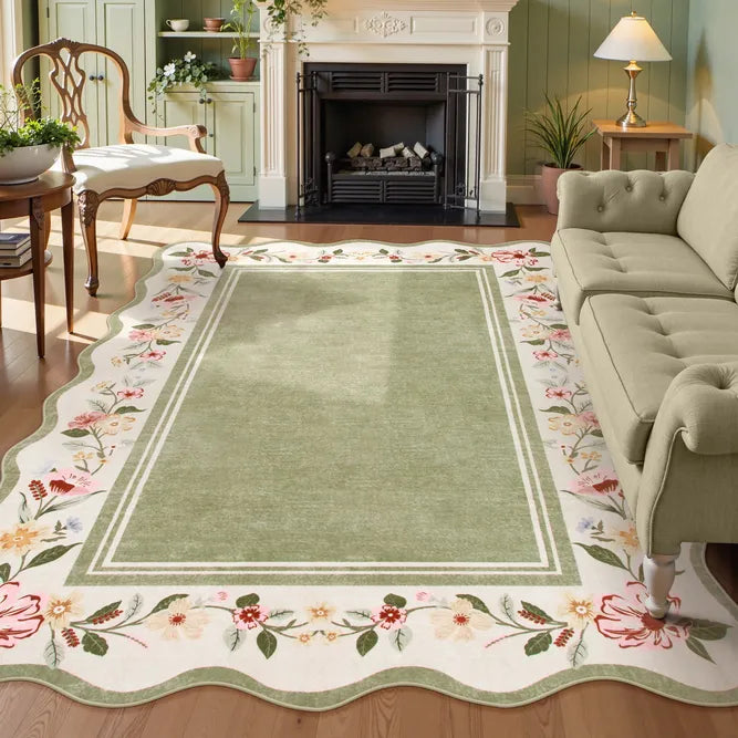 Covaba vintage floral scalloped area rug in willow sage, styled in a room setting