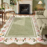 Covaba vintage floral scalloped area rug in willow sage, styled in a room setting