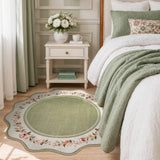 Covaba vintage floral scalloped round rug in willow sage, styled in a room setting, view 2