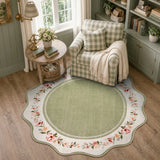Covaba vintage floral scalloped round rug in willow sage, styled in a room setting, view 3
