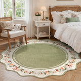 Covaba vintage floral scalloped round rug in willow sage, styled in a room setting, view 4