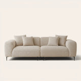 Almond cream chenille stretch cover fitted on a plush three-seat sofa, front view on ivory backdrop