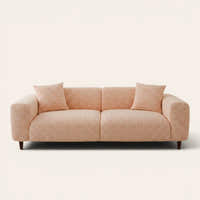 Peach clay chenille stretch cover fitted on a plush three-seat sofa, front view on ivory backdrop