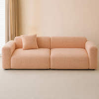Peach clay chenille sofa cover in a warm sunlit room, styled with a cushion beside the window