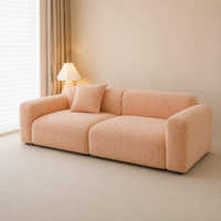 Peach clay chenille sofa cover, side angle in a bright room with a lamp and matching cushion