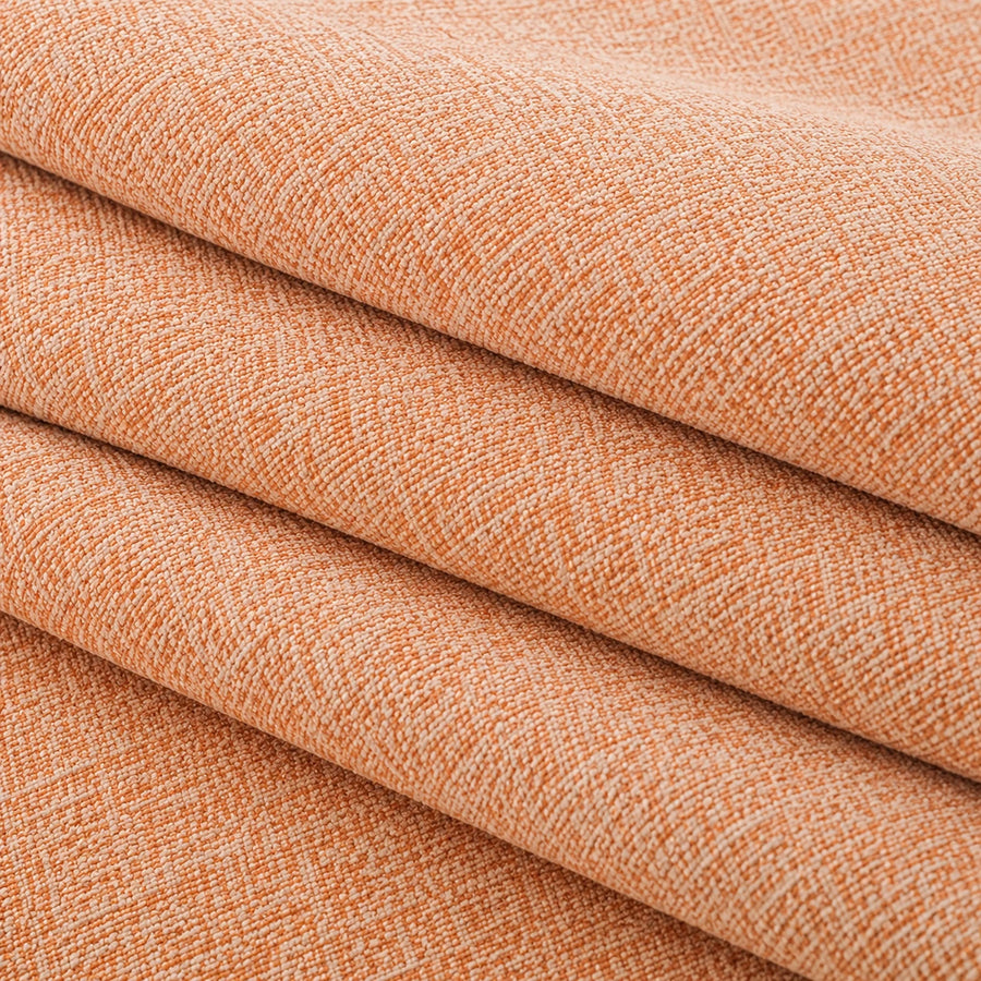 Folded stack of peach clay chenille fabric in close-up, highlighting the woven weave