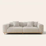 Sage veil chenille stretch cover fitted on a plush three-seat sofa with wooden base, front view