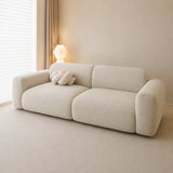 Sage veil chenille sofa cover, side angle in a warm minimalist room with a knot cushion