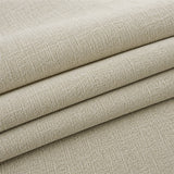 Folded stack of sage veil chenille fabric in close-up, highlighting the woven weave