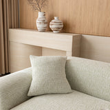 Sage veil chenille sofa cover with a matching cushion on the seat, beside a wood console