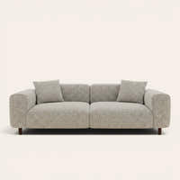 Stone mist chenille stretch cover fitted on a plush three-seat sofa, front view on ivory backdrop
