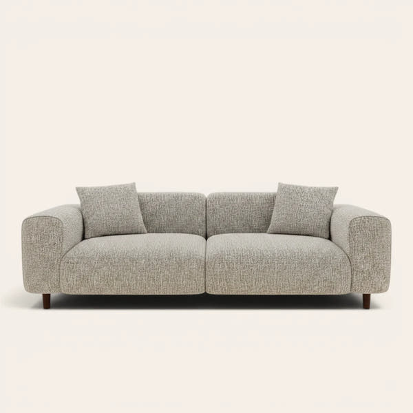Stone mist chenille stretch cover fitted on a plush three-seat sofa, front view on ivory backdrop