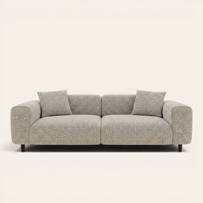 Stone mist chenille stretch cover fitted on a plush three-seat sofa, front view on ivory backdrop