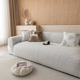 Side view of the stone mist chenille sofa cover showing the soft woven texture across seat and armrest