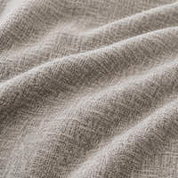 Macro of stone mist chenille fabric in soft folds revealing the woven cross-hatch weave