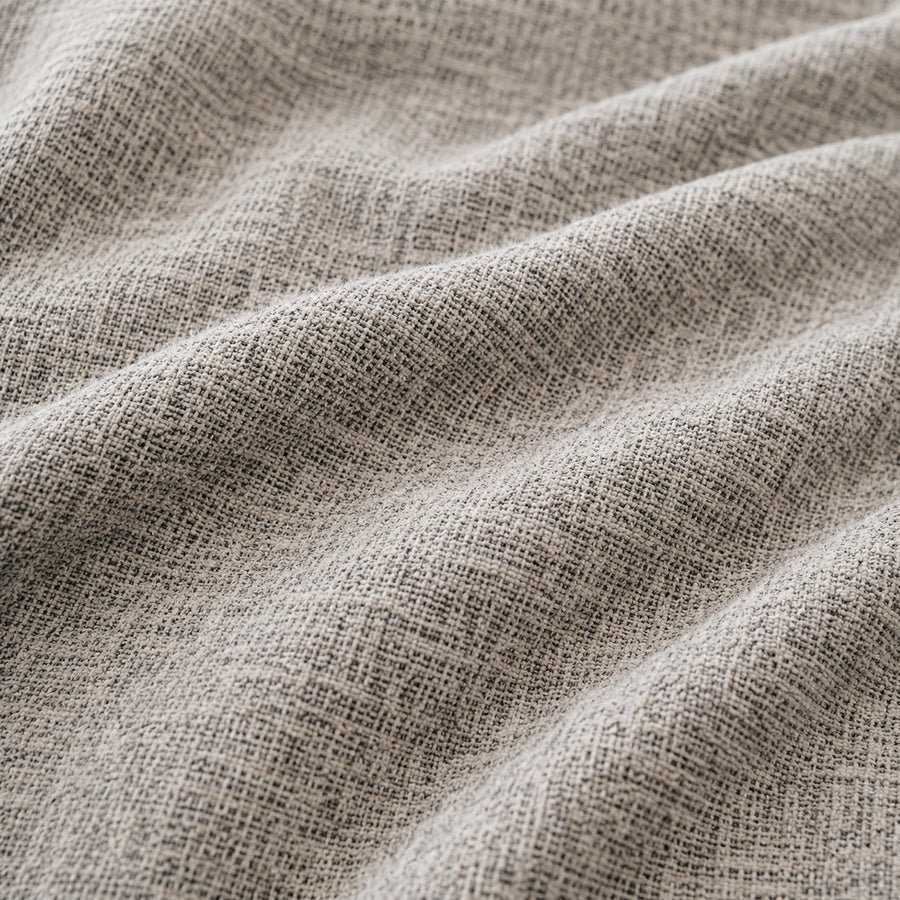 Macro of stone mist chenille fabric in soft folds revealing the woven cross-hatch weave