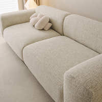 Angled close-up of the willow haze chenille seat and rounded backrest showing woven texture