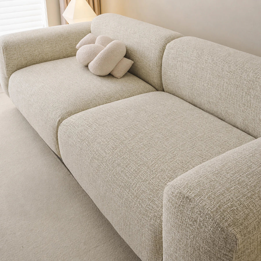 Angled close-up of the willow haze chenille seat and rounded backrest showing woven texture