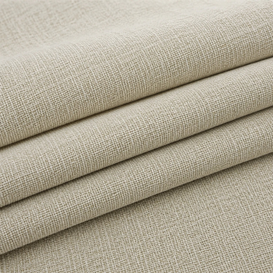 Folded stack of willow haze chenille fabric in close-up, highlighting the woven weave