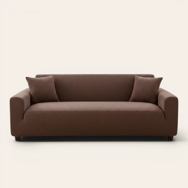 Cocoa brown corduroy stretch sofa cover fitted on a three-seat sofa, front view on ivory backdrop