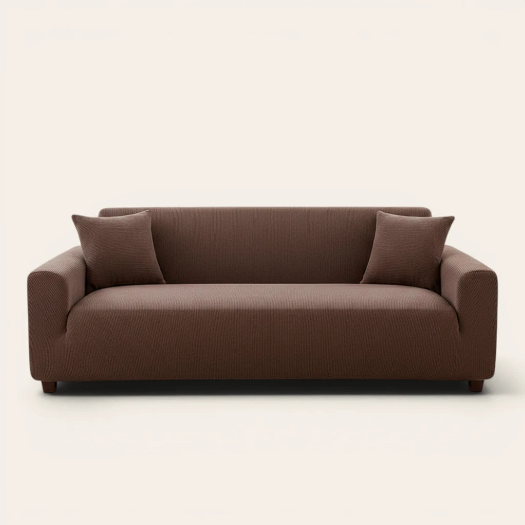 Cocoa brown corduroy stretch sofa cover fitted on a three-seat sofa, front view on ivory backdrop