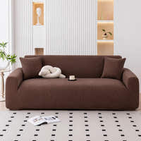 Cocoa brown corduroy sofa cover in a modern living room with fluted wall and cream cushions