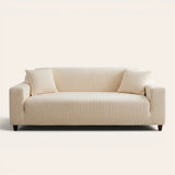 Cream corduroy stretch sofa cover fitted on a two-seat sofa, front view on ivory backdrop